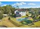 Stunning aerial view of the property showcasing the private pool, manicured lawn, and serene surroundings at 7876 Marsh Pointe Dr, Tampa, FL 33635