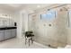 Bathroom features a glass walk-in shower, a rain shower head, and a double sink at 7876 Marsh Pointe Dr, Tampa, FL 33635