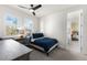 Bright bedroom features a desk, chair, natural light, and an ensuite bathroom at 7876 Marsh Pointe Dr, Tampa, FL 33635