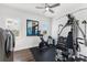 Home gym equipped with exercise bike, weight machines, and laundry, creating a functional workout space at 7876 Marsh Pointe Dr, Tampa, FL 33635