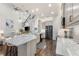 Modern kitchen boasts granite countertops, stainless steel appliances, and a spacious island with seating at 7876 Marsh Pointe Dr, Tampa, FL 33635