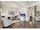 Bright living room features hardwood floors, modern furnishings, and a unique built-in fish tank display at 7876 Marsh Pointe Dr, Tampa, FL 33635