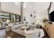 Spacious living room with soaring ceilings, large windows, and comfortable, modern furnishings at 7876 Marsh Pointe Dr, Tampa, FL 33635