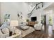 Bright living area features a staircase with iron spindles and an open layout ideal for entertaining at 7876 Marsh Pointe Dr, Tampa, FL 33635