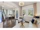 This living room showcases elegant décor, plantation shutters, and an open layout leading to the dining area at 7876 Marsh Pointe Dr, Tampa, FL 33635