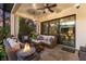 Inviting outdoor patio with cozy seating, fire pit, and lush greenery at 7876 Marsh Pointe Dr, Tampa, FL 33635