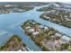 An expansive aerial view highlighting waterfront homes nestled among a network of tranquil canals and lush landscapes at 79 Palm Dr, Placida, FL 33946