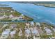 Expansive aerial view of an island community, highlighting waterfront homes with access to serene waterways at 79 Palm Dr, Placida, FL 33946