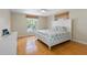 Comfortable bedroom with natural light, hardwood floors, and neutral tones, creating a serene atmosphere at 79 Palm Dr, Placida, FL 33946