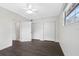 Bedroom with neutral walls, hardwood floors, and a bright ceiling fan at 79 Palm Dr, Placida, FL 33946