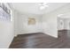 Bright bedroom with hardwood floors and ample natural light from windows at 79 Palm Dr, Placida, FL 33946