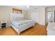 Comfortable bedroom with a hardwood floor, a ceiling fan, and a window with blinds at 79 Palm Dr, Placida, FL 33946