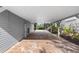 A covered carport area features a brick paver driveway, offering shade and protection for vehicles at 79 Palm Dr, Placida, FL 33946