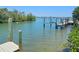 This waterfront home features a private dock and boat lift, with direct access to the water and stunning views at 79 Palm Dr, Placida, FL 33946