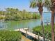 Enjoy waterfront living with this property featuring a private dock and serene views of the surrounding nature at 79 Palm Dr, Placida, FL 33946