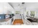 Modern kitchen with stainless steel appliances, granite countertops, and lots of natural light at 79 Palm Dr, Placida, FL 33946