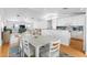 Bright open-concept living space featuring modern finishes, a spacious dining area, and seamless flow to the kitchen at 79 Palm Dr, Placida, FL 33946