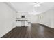 Open-concept area featuring a wet bar, sleek flooring, and ample natural light at 79 Palm Dr, Placida, FL 33946