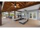 Entertain in style with this covered patio featuring lounge furniture, ceiling fans and easy access to the main house at 79 Palm Dr, Placida, FL 33946