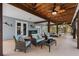 Expansive outdoor patio with comfortable seating and tropical ceiling fans, perfect for entertaining at 79 Palm Dr, Placida, FL 33946