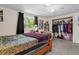 Cozy bedroom with closet, desk, fan and ample storage space at 8537 Cameo Dr, New Port Richey, FL 34654