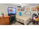Eclectic bedroom decor featuring colorful posters and quirky decorations at 8537 Cameo Dr, New Port Richey, FL 34654