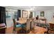 Dining room features a dining table set for six and hardwood floors at 8537 Cameo Dr, New Port Richey, FL 34654