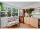 Cozy sitting area featuring large windows, neutral colors and wood accents at 8537 Cameo Dr, New Port Richey, FL 34654