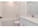 Clean bathroom with a white subway-tiled shower-tub combination and a modern sink with chrome faucet at 11307 Linden Depot Rd, San Antonio, FL 33576