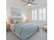 Stylishly furnished bedroom with light blue accents, plantation shutters and lots of light at 11307 Linden Depot Rd, San Antonio, FL 33576