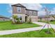 Home with a two-car garage, landscaping, and neutral-colored facade in a suburban neighborhood at 11307 Linden Depot Rd, San Antonio, FL 33576
