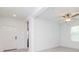 Bright and airy living room featuring white walls, minimalist design, and tiled floors at 11307 Linden Depot Rd, San Antonio, FL 33576