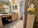 Bathroom featuring vanity with sink, decorative accents and tile flooring at 12411 Cavalier Ct, Hudson, FL 34669