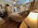 Spacious bedroom with tray ceilings and an adjoining ensuite bathroom at 12411 Cavalier Ct, Hudson, FL 34669
