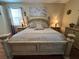 Cozy primary bedroom with neutral tones, decor and furnishings at 12411 Cavalier Ct, Hudson, FL 34669