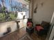 Covered patio featuring tile flooring, neutral decor and view to backyard at 12411 Cavalier Ct, Hudson, FL 34669