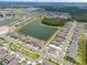 Beautiful aerial view of a modern community with ponds and well-maintained landscaping on a sunny day at 12854 Boggy Creek Dr, Riverview, FL 33579