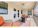 Outdoor balcony space with seating, a fire pit, and serene outdoor views at 12854 Boggy Creek Dr, Riverview, FL 33579
