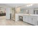 Modern bathroom featuring a glass shower with stylish tile, vanity area, and bright lighting at 12854 Boggy Creek Dr, Riverview, FL 33579