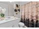 Stylish bathroom featuring a decorative shower curtain, modern sink and fixture at 12854 Boggy Creek Dr, Riverview, FL 33579