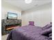 Stylish bedroom featuring a modern fireplace under TV, providing warmth and ambiance at 12854 Boggy Creek Dr, Riverview, FL 33579
