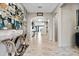 Elegant foyer features high ceilings, tile floors, and ornate decorative art at 12854 Boggy Creek Dr, Riverview, FL 33579