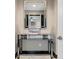 Elegant foyer with marble floors, a mirrored console table and a large decorative mirror at 12854 Boggy Creek Dr, Riverview, FL 33579