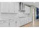 Modern kitchen features white cabinets, stainless steel appliances, and a large island at 12854 Boggy Creek Dr, Riverview, FL 33579