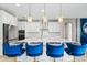 Modern kitchen features white cabinets, stainless steel appliances, and a large island at 12854 Boggy Creek Dr, Riverview, FL 33579