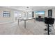 Spacious living room with a pool table, modern lighting, and large-screen television at 12854 Boggy Creek Dr, Riverview, FL 33579