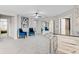 Well-lit loft area with mirrored bar, stylish seating, and connecting rooms at 12854 Boggy Creek Dr, Riverview, FL 33579