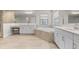 Bright bathroom featuring double vanities, soaking tub, and separate walk-in shower at 12854 Boggy Creek Dr, Riverview, FL 33579