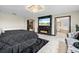 Spacious main bedroom with TV, fireplace, and entrance to the main bathroom at 12854 Boggy Creek Dr, Riverview, FL 33579