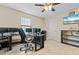 Home office with 3 computer monitors and modern furnishings at 12854 Boggy Creek Dr, Riverview, FL 33579